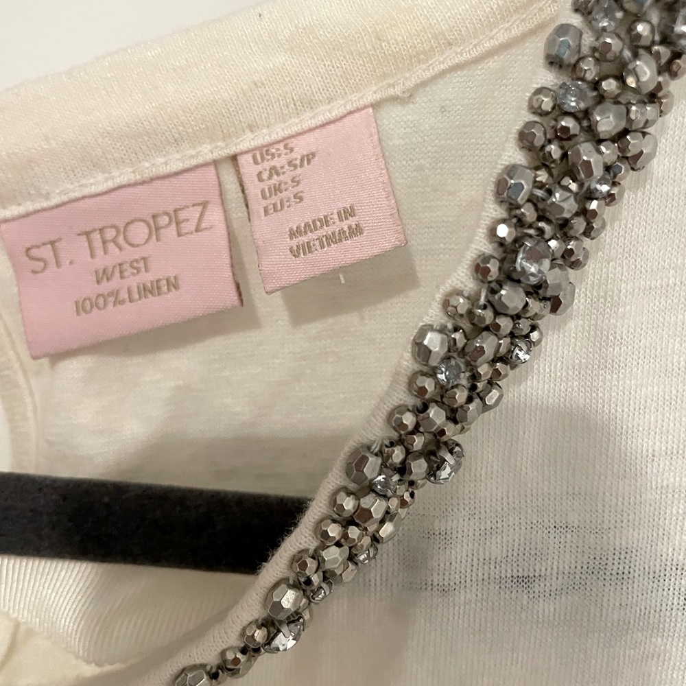 Sleeveless top with beaded neckline